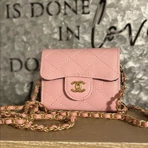 Pink chain wallet.